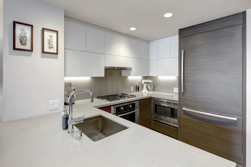 Current image: Split-screen comparison of flat-panel and shaker kitchen cabinets showing differences in style and long-term design flexibility